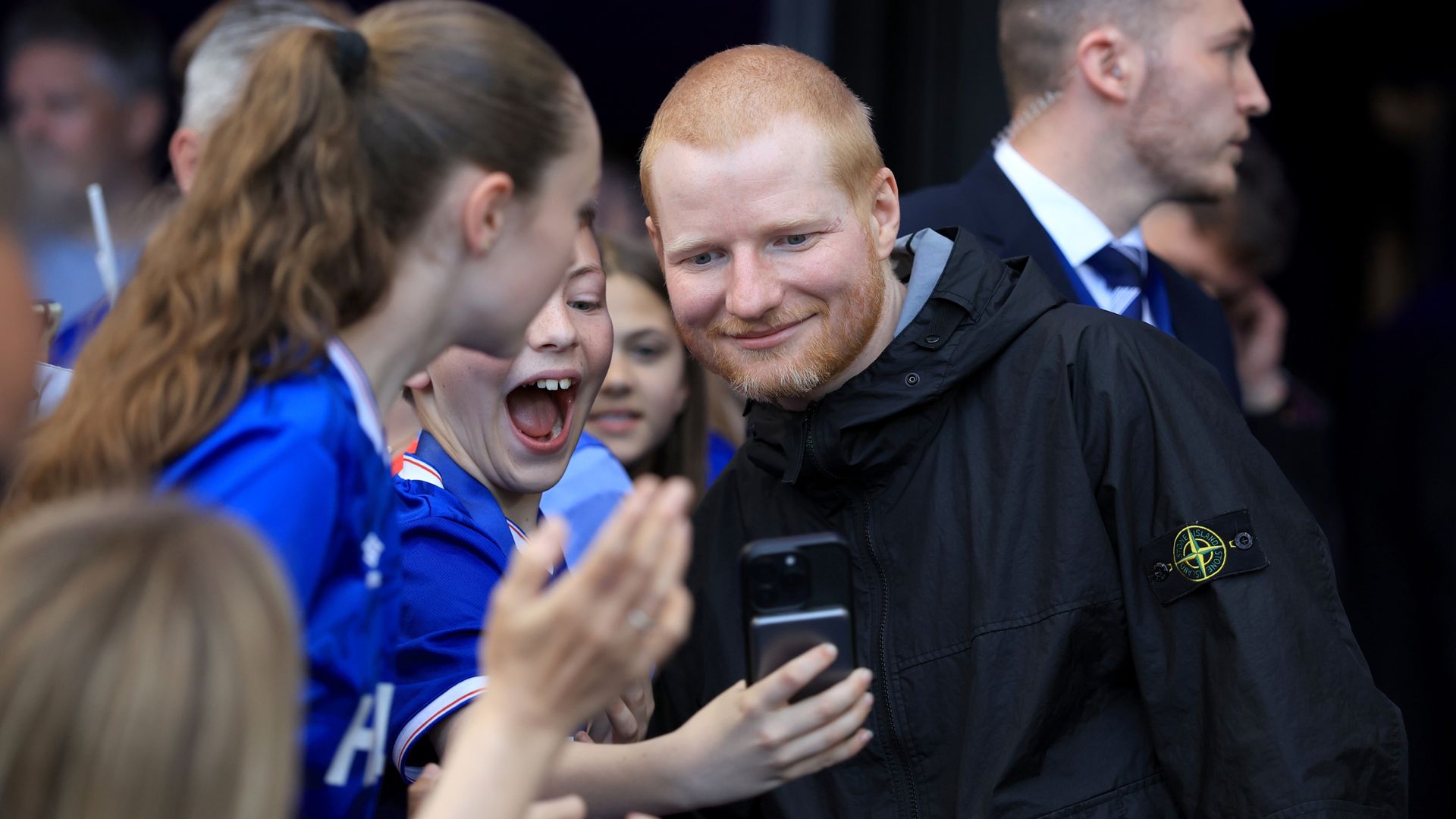 Ed Sheeran celebrates Ipswich Town's return to Premier League with dressing room singalong