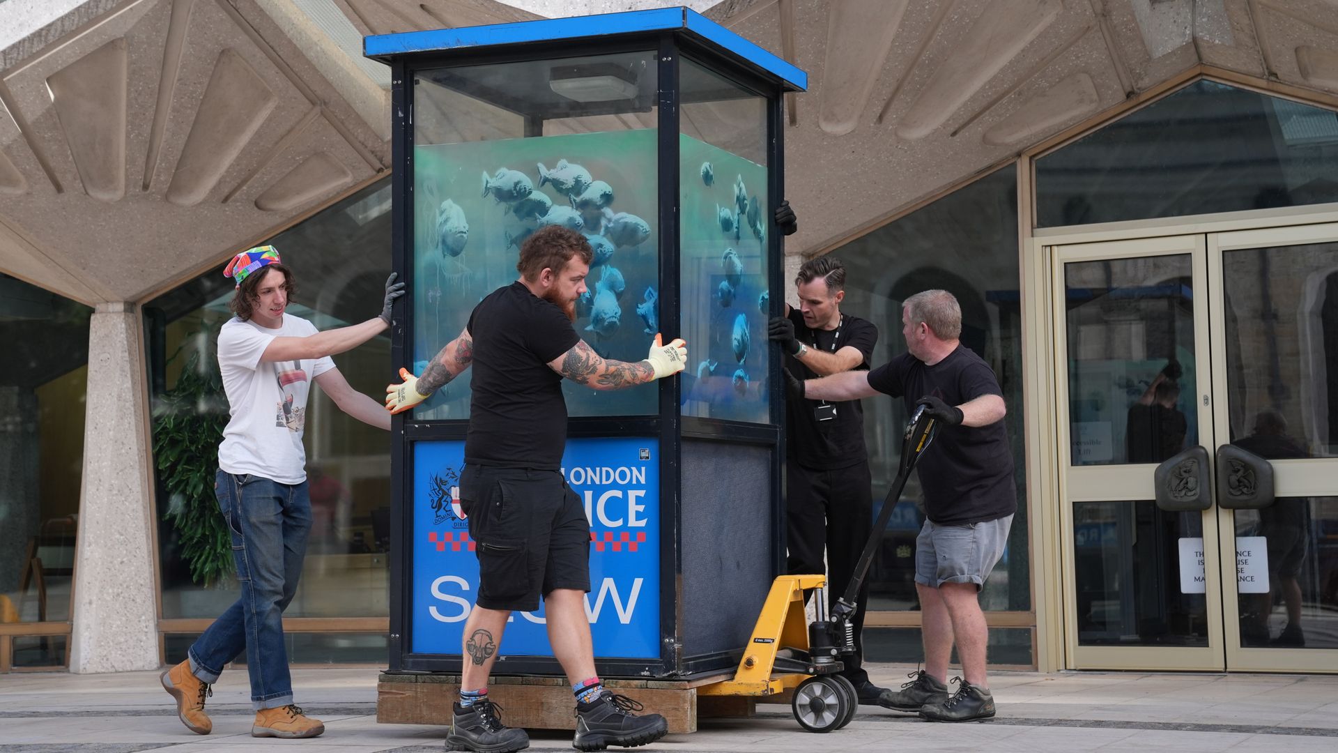 Banksy's piranhas police box put in protective storage ahead of museum display