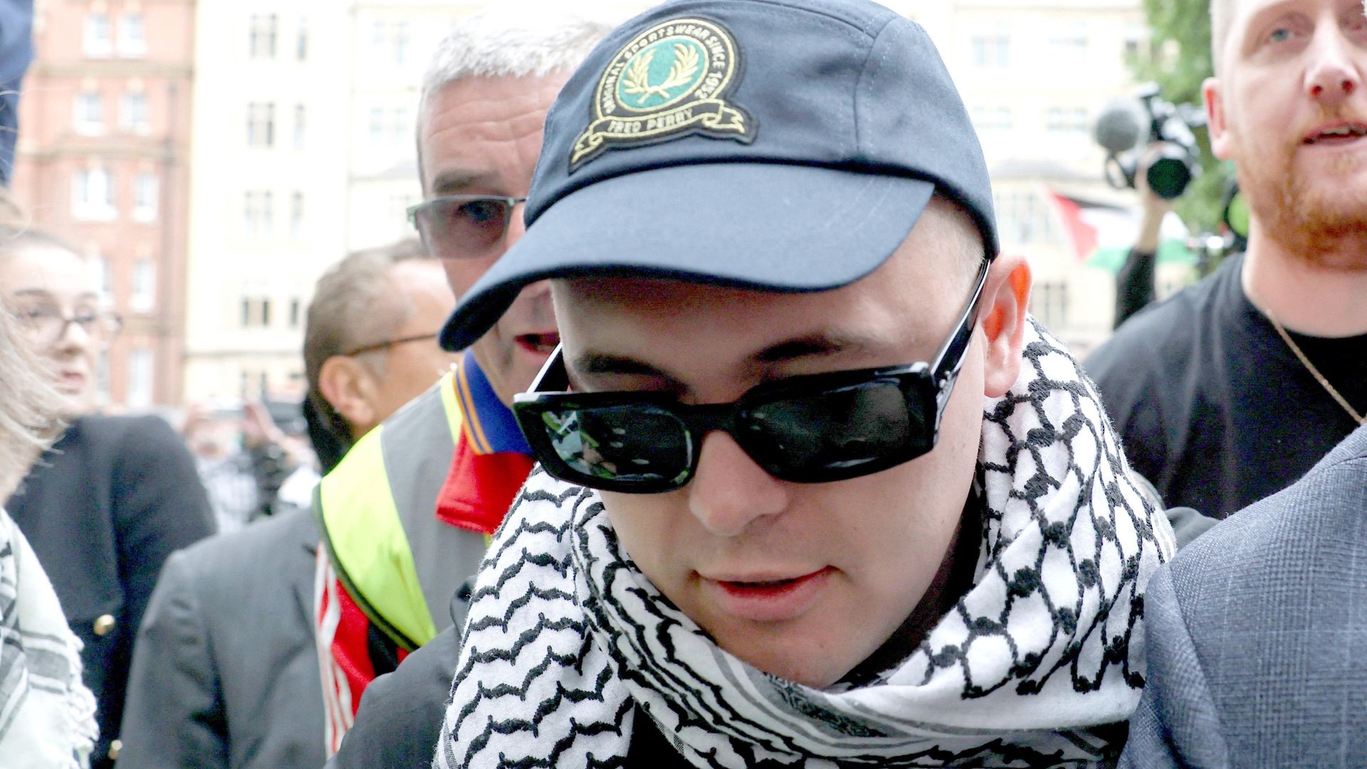 Kneecap rapper greeted by hundreds of supporters at terror charge court hearing