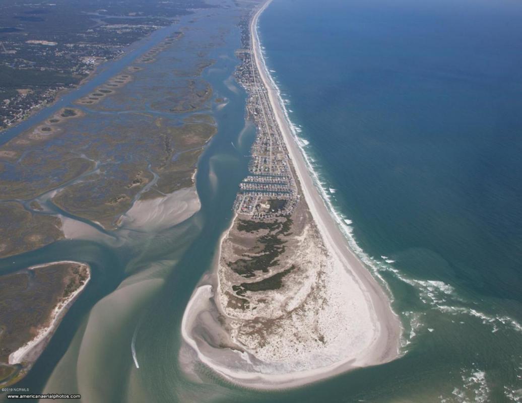Northern investors buy Serenity Point. Rename it Yankee Beach