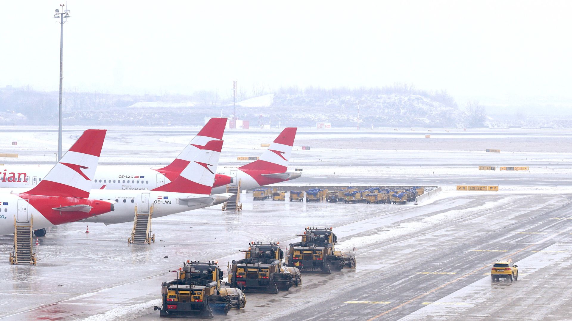 Airports close and flights disrupted as freezing rain and snow hits Europe