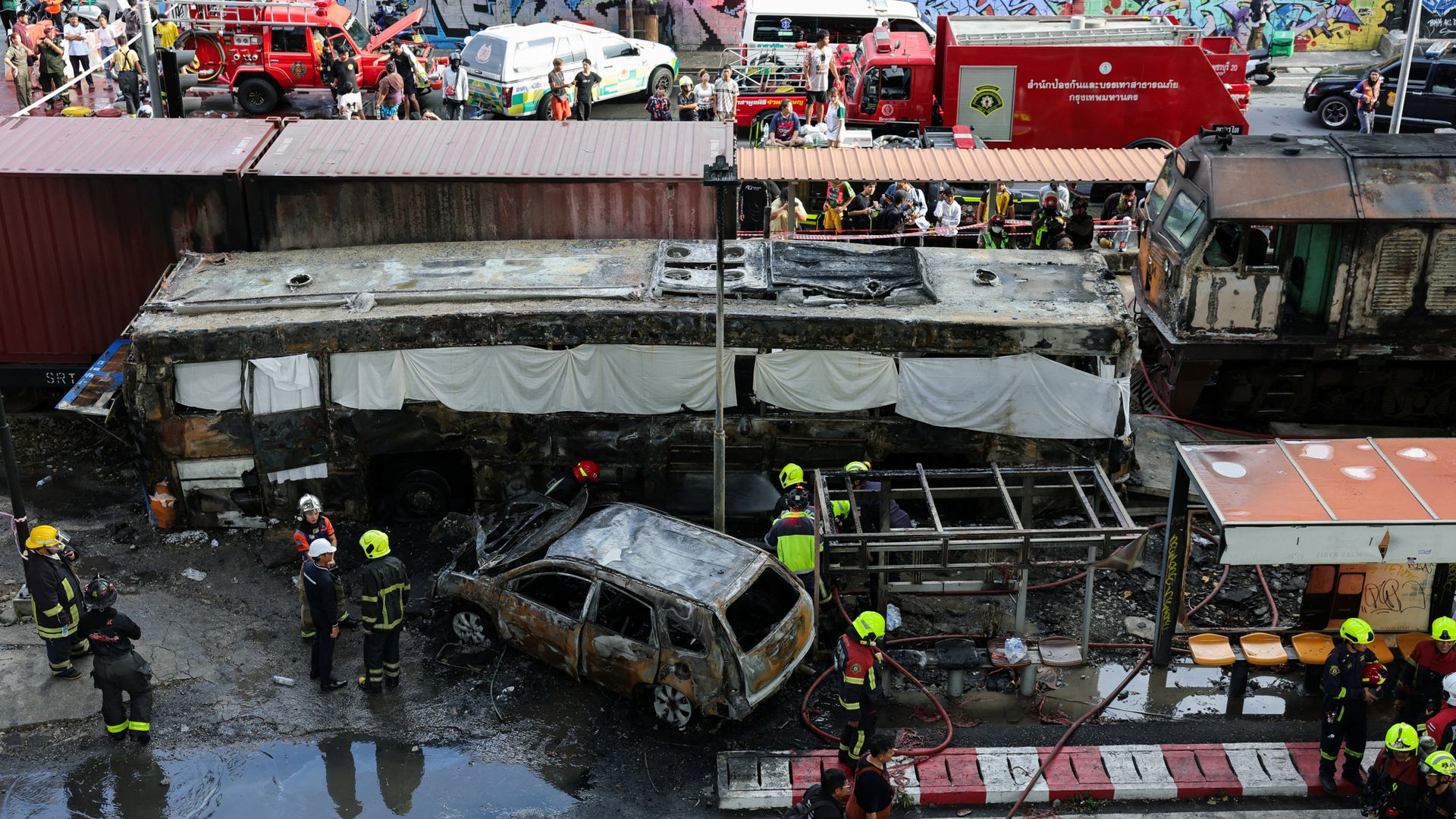 Freight train hits bus in Thailand - eight dead