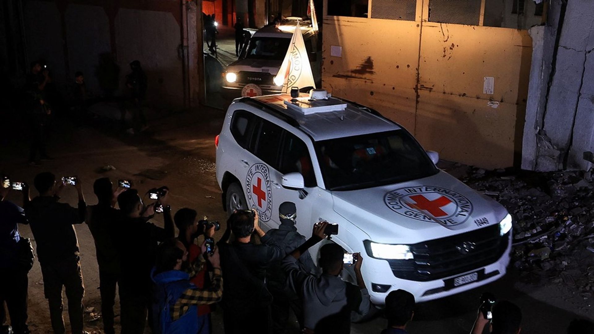 Israel rows back on plan to limit aid into Gaza - as bodies of four more hostages released