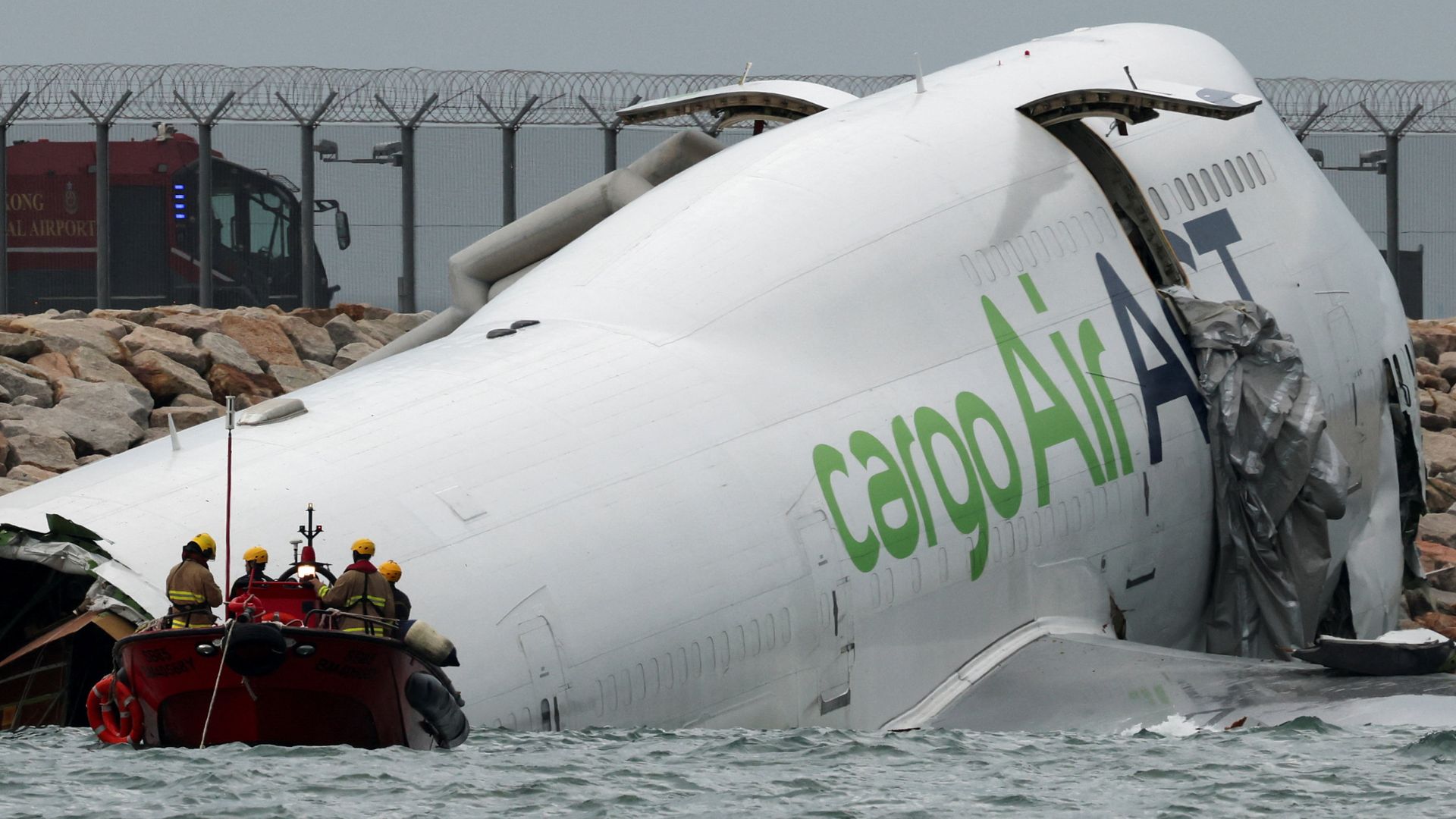 Cargo plane slides off runway in Hong Kong - reports say two dead