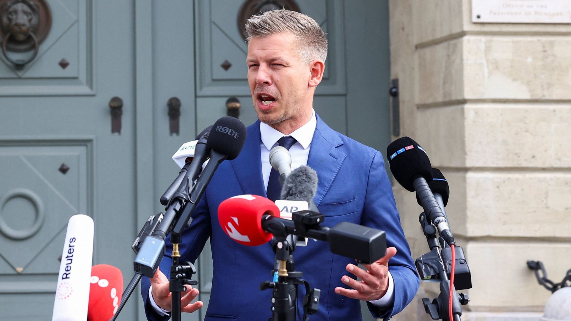 Hungary's new PM tells 'unworthy' president to resign