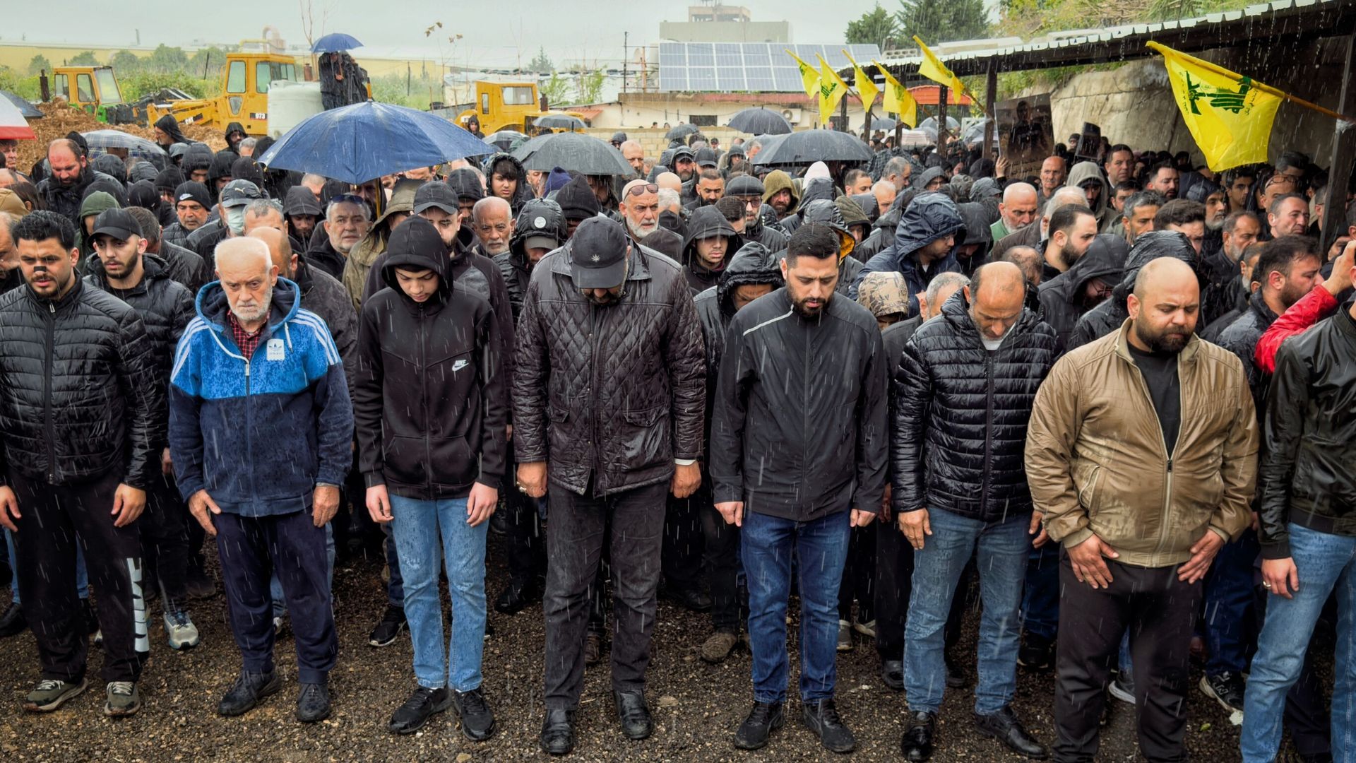 Hundreds of mourners gather in pouring rain for funerals of Lebanon journalists