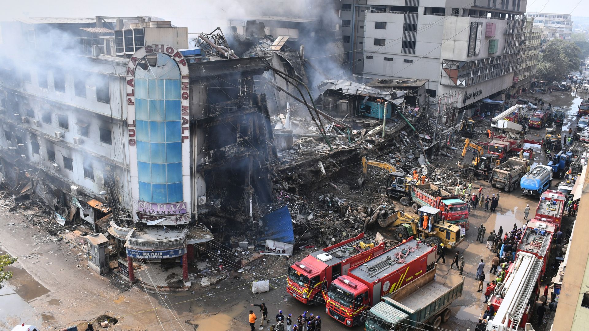 Bodies of 23 recovered from shopping centre fire in Pakistan, as dozens remain missing