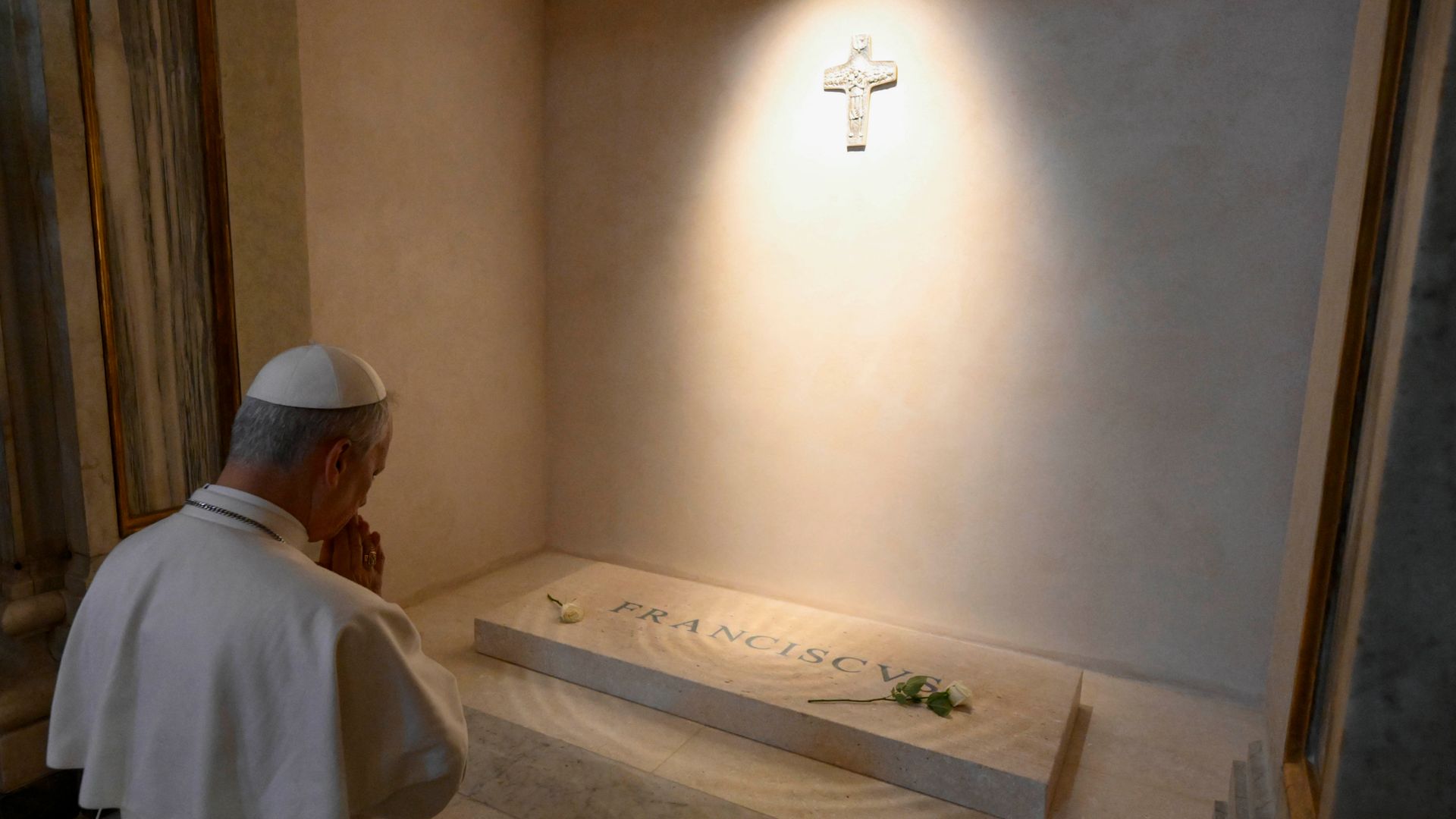 Pope prays at tomb of predecessor during first outing