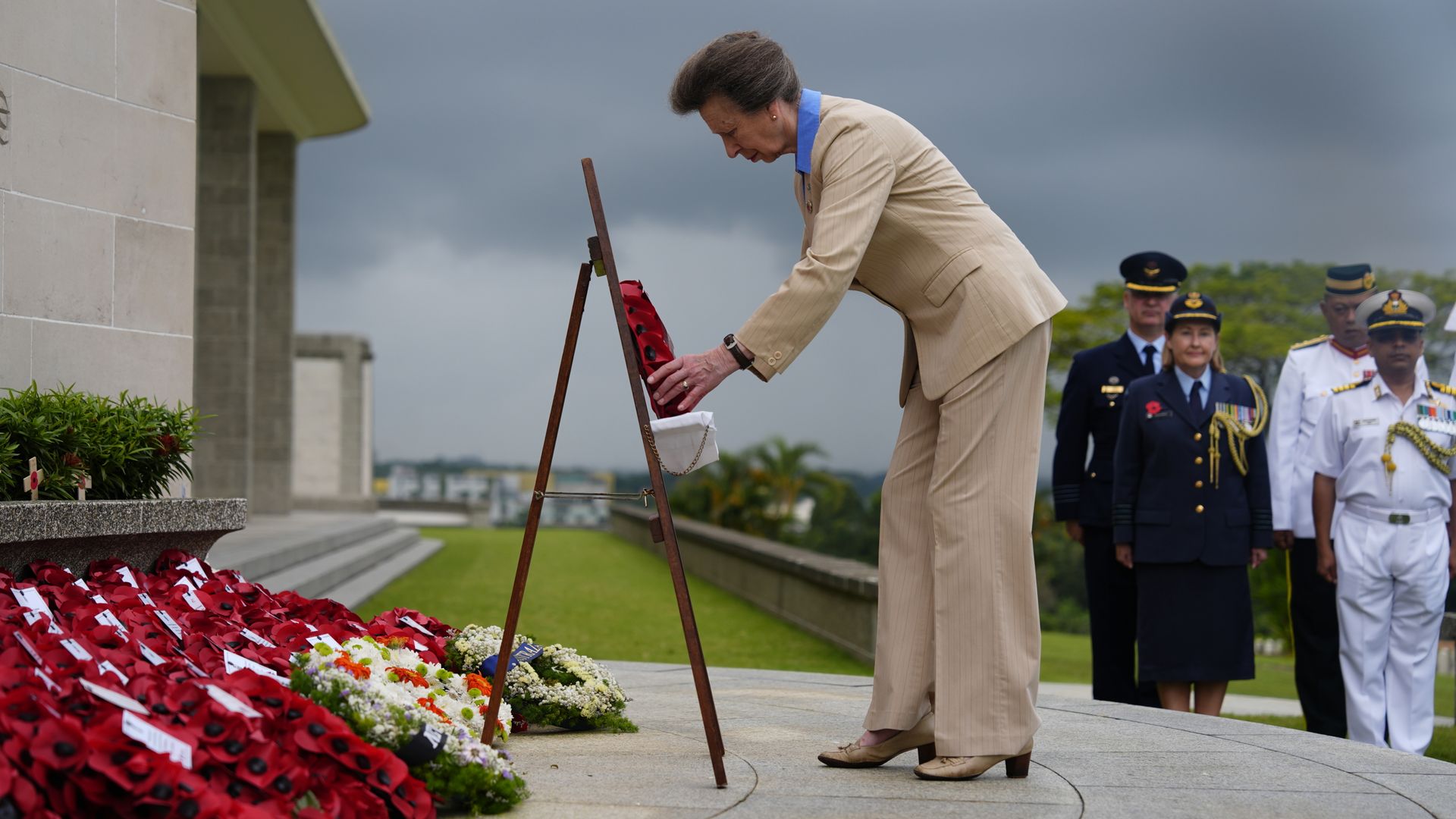 Princess Anne lays a wreath at memorial service in Singapore