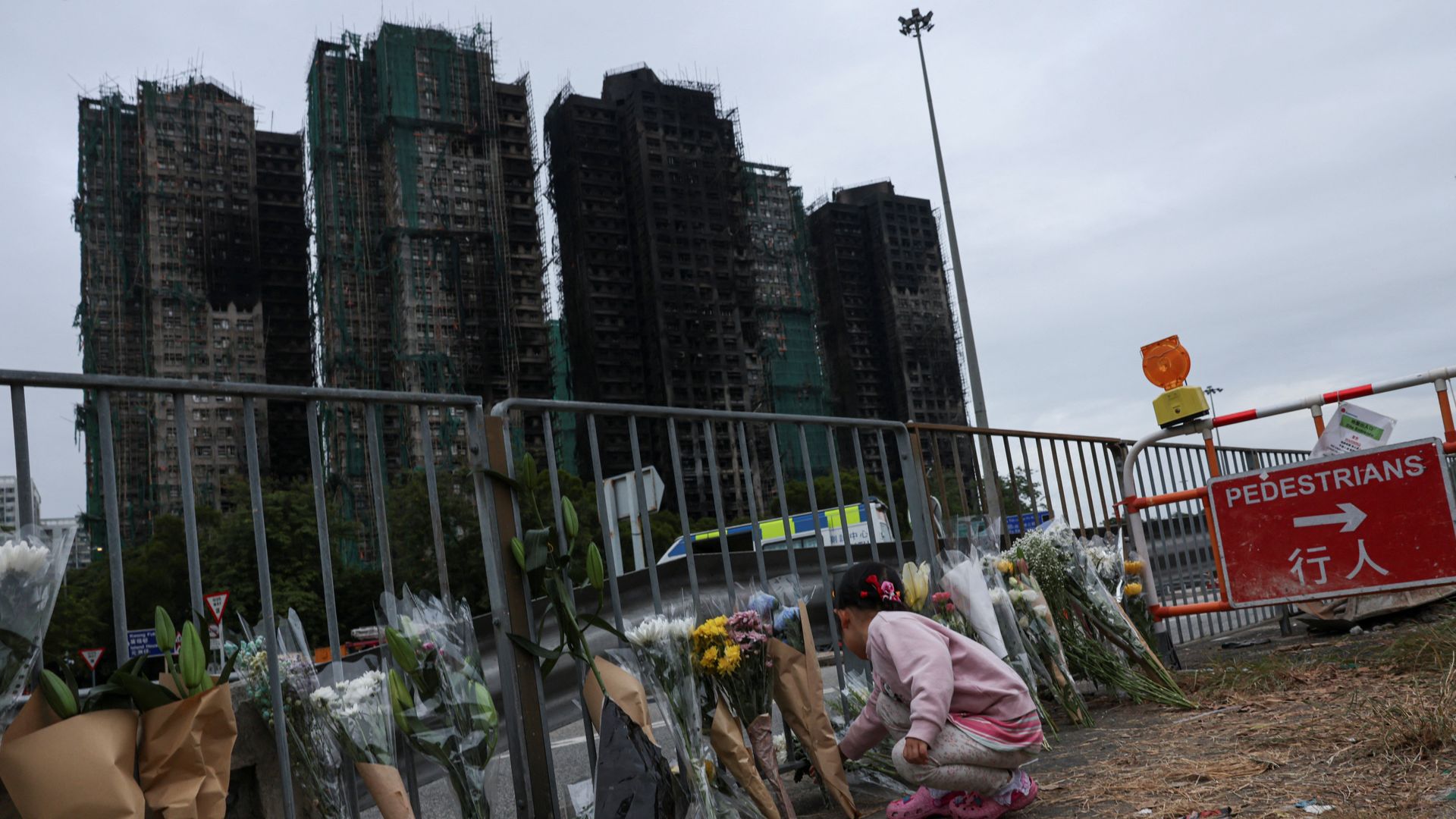 Death toll rises in Hong Kong apartment complex fire as more bodies found in burned buildings