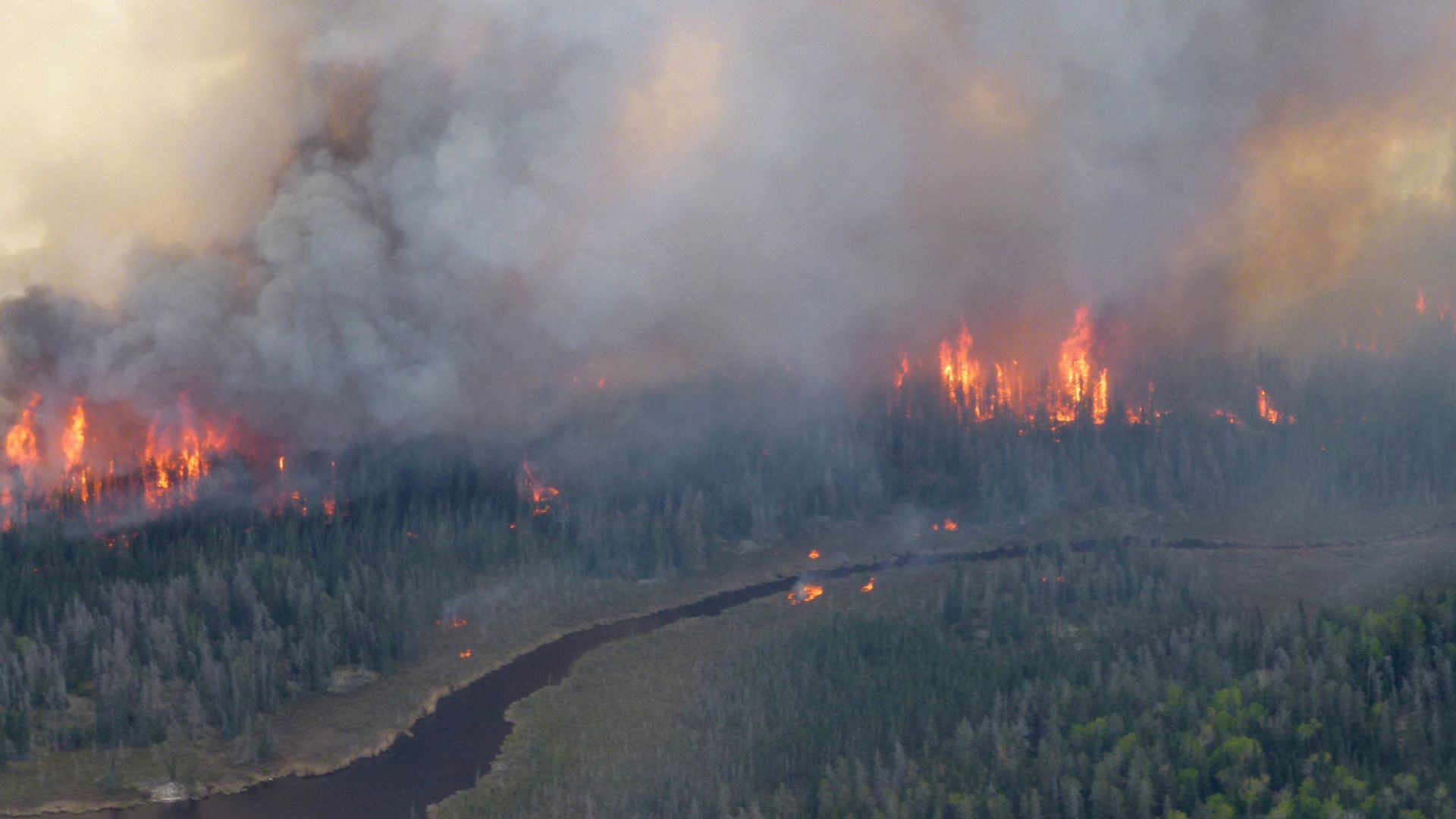 Thousands evacuated as wildfires rage and air quality suffers